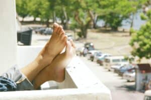 Person resting feet on ledge